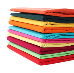 Stack of clean colorful t-shirts isolated on white