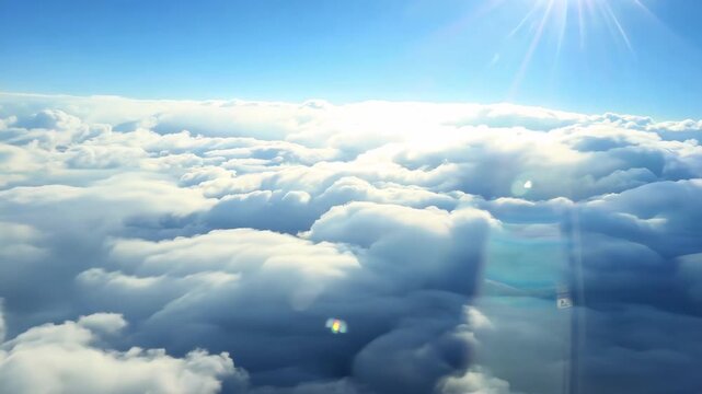 Looking out the window in plane cabin. Airplane transportation flight. Excited fly to destination. Comfort business class trip. Beautiful view of fluffy soft white clouds over the city. Epic sky.