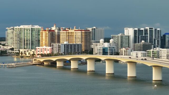 USA travel destination. Aerial view of Sarasota city downtown with Ringling Bridge and high-rise office buildings on horizon. Real estate development in Florida