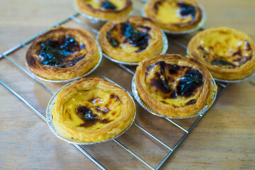 Homemade of custard pies on grille