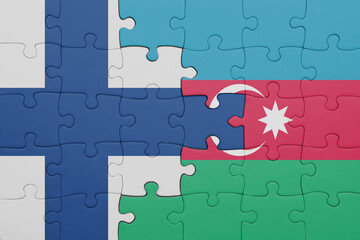 puzzle with the colourful national flag of azerbaijan and flag of finland.