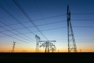 The pylons are in the evening, Substation in the evening, High voltage substation and beautiful sunset glow