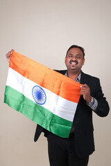 A proud gentleman holding the Indian flag, symbolizing patriotism and national pride.