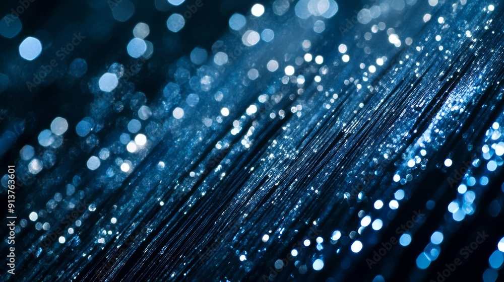 Poster shimmering silver and blue lights cascade over a dark background, creating a unique and dynamic text