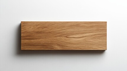 A blank wooden sign rests against a clean white background, showcasing its simple, elegant design, ideal for customization and artistic projects