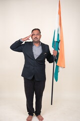 A proud gentleman holding the Indian flag, symbolizing patriotism and national pride.