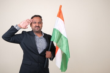 A proud gentleman holding the Indian flag, symbolizing patriotism and national pride.