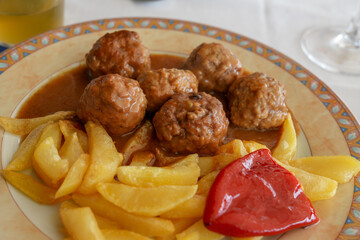 Meatballs in tomato sauce with herbs. Spanish recipe.