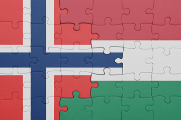 puzzle with the colourful national flag of hungary and flag of norway .