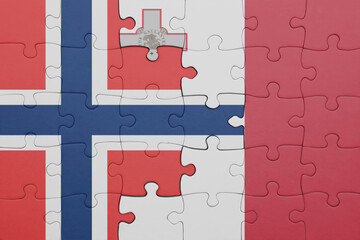 puzzle with the colourful national flag of malta and flag of norway .