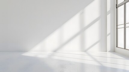 A bright white room with light shining through the window, casting soft shadows on an empty wall. creating an abstract and minimalist background for product display or presentation