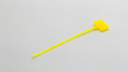 Yellow cable ties with markings isolated