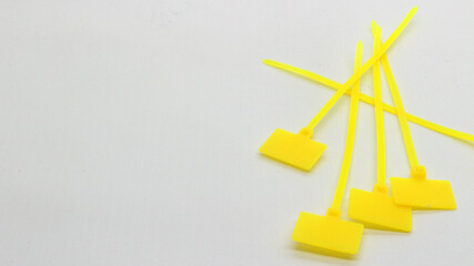 Yellow cable ties with markings isolated