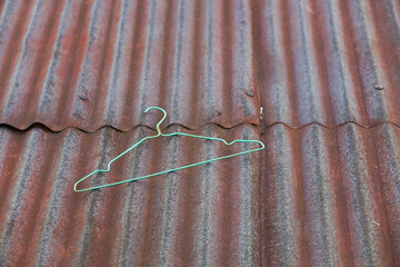 The corrugated zinc roof is old and rusted. Despite the long period of use, this roof still shows...