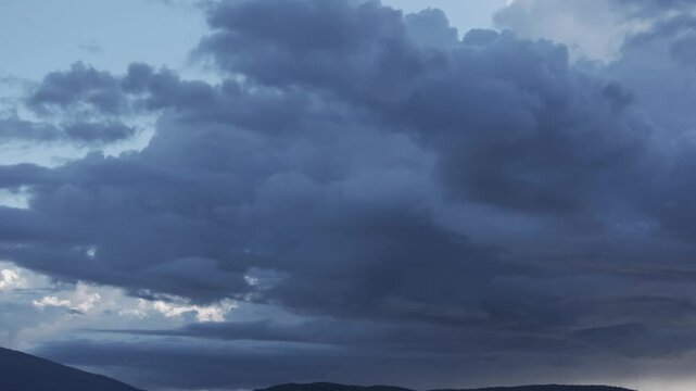 filming some large storm clouds with a 70mm drone, we entered them with a turn and discovered that in the lower parts with the mountains a glow appears, clarifying that bright white area