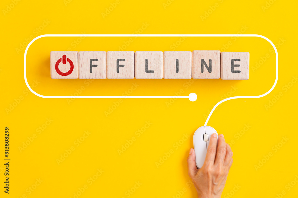 Poster offline text with red closed button instead of O on wooden cube block with hand using computer mouse on yellow background