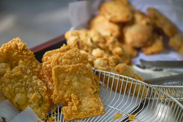 Gorengan is appetizing. There are fried tempeh pieces with a crunchy texture. Sold by street vendors.