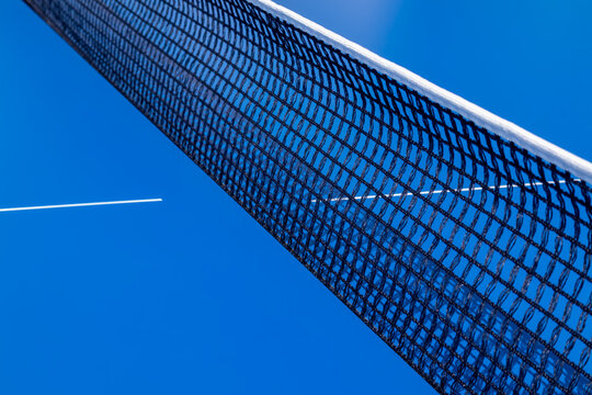 Close-up of a table tennis net under a clear blue sky