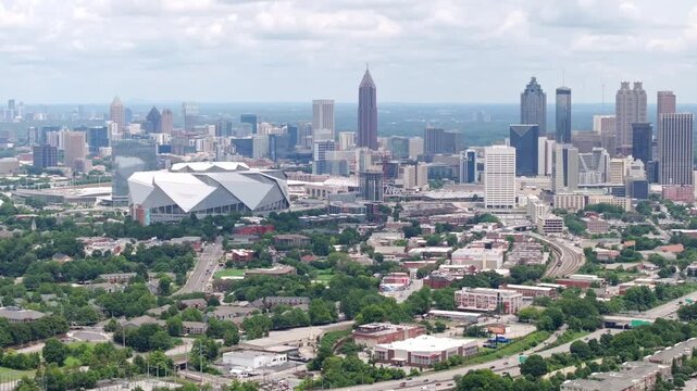 Aerial view of Downtown Atlanta Georgia skyline and skyscrapers, Mercedes Benz Stadium corporate office and street view