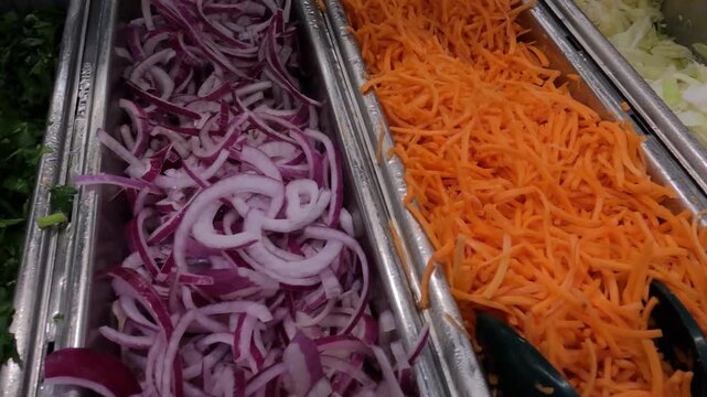 Shredded Vegetables in Containers in Buffet Restaurant, Close Up
