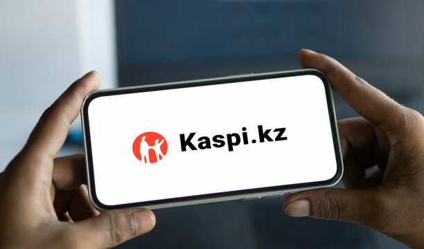 Dhaka, Bangladesh- 08 Aug 2024: Kaspi.kz AO logo is displayed on smartphone.