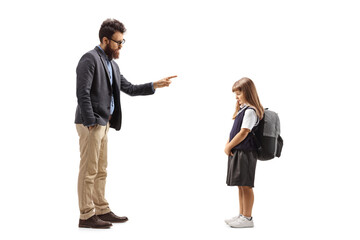 Full length profile shot of a man reprimanding a schoolgirl