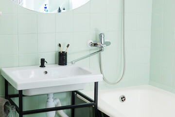 Budget bathroom interior in bright colors. Details of the bathroom interior.