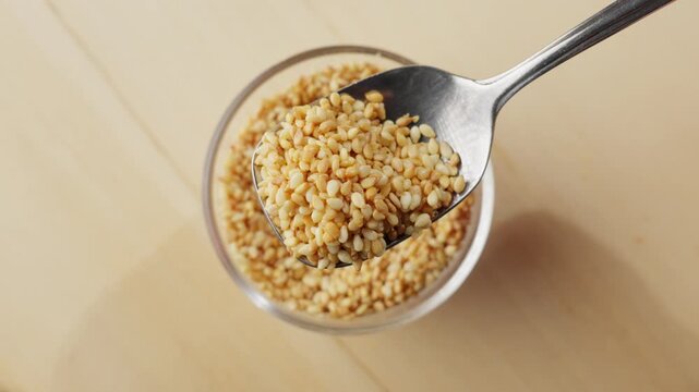 Slow motion close up of small Korean sesame seeds