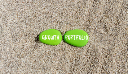 Growth portfolio symbol. Concept words Growth portfolio on beautiful green stone. Beautiful sea sand beach background. Business Growth portfolio concept. Copy space.