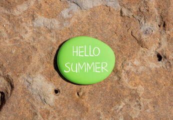 Hello summer symbol. Concept words Hello summer on beautiful green stone. Beautiful red stone...