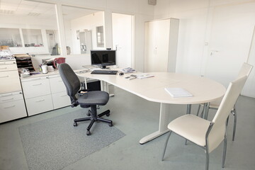 Messy office room of a closed down factory, no people