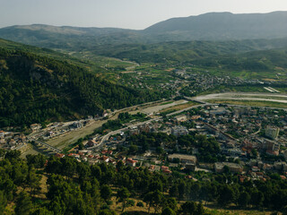 BERAT, ALBANIA, April 13, 2024: Berat castle viewed from boulevard Republika in Albania