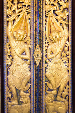 Ornate golden door at the temple entrance, Luang Prabang, Laos