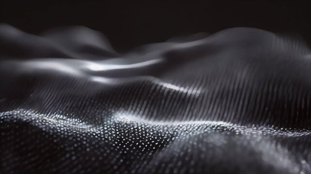 Flowing white dots on black wave pattern
