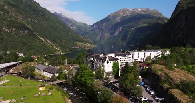 Aerial Boom Shot Above Village of Geiranger in Geirangerfjord, Norway.