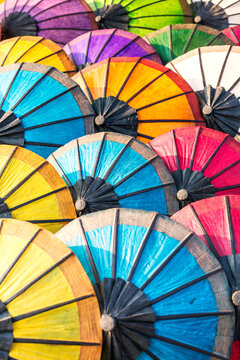 Colorful paper umbrellas at the local market, Laos