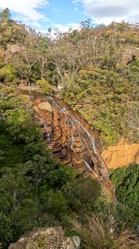 Landscape of Wentworth Falls is a three-tiered waterfall fed by the Jamison Creek, near the town of Wentworth Falls in the Blue Mountains region of New South Wales Australia - Footage Nature Track