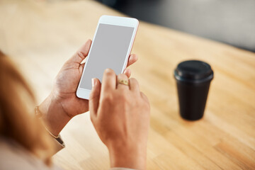 Smartphone, screen and hands of person on table, scroll and chat with online contact by mockup. Office, employee and cellphone with mobile app for connection, networking and text message to client