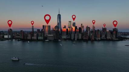 GPS location pins above skyscrapers. Aerial of Manhattan, New York City skyline at sunset. Tourist...