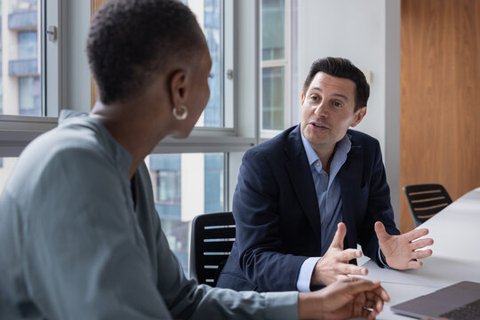 Businessman sharing an idea in a corporate office meeting room