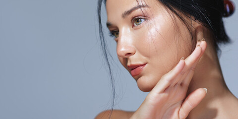Elegant Woman with Hydrated Skin and Hand Posed Gracefully