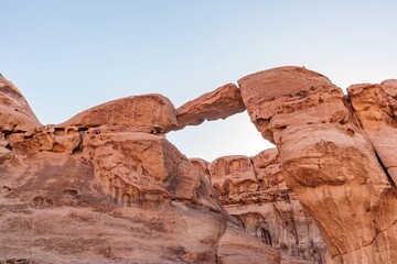 Um Frouth Rock Arch, natural rock bridge in the Wadi Rum Desert, Jordan. Landscape of the Wadi Rum...