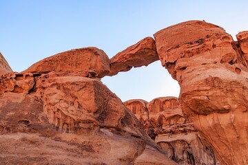 Fototapeta premium Um Frouth Rock Arch, natural rock bridge in the Wadi Rum Desert, Jordan. Landscape of the Wadi Rum desert in Jordan
