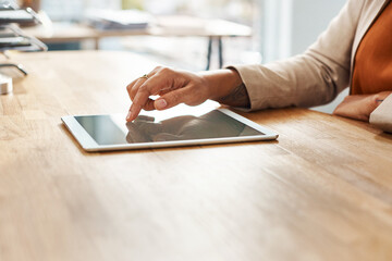 Hands, scrolling and tablet with business person at wooden desk of office for email, feedback or report. Finger, press for research and technology with corporate employee in professional workplace