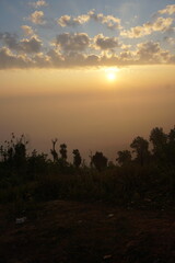 sunrise in the mountains. Beautiful Maraingtong Hill, clouds over the mountains, view from the top of mountain, view of a forest, natural beauty Bandarban. Bangladesh.