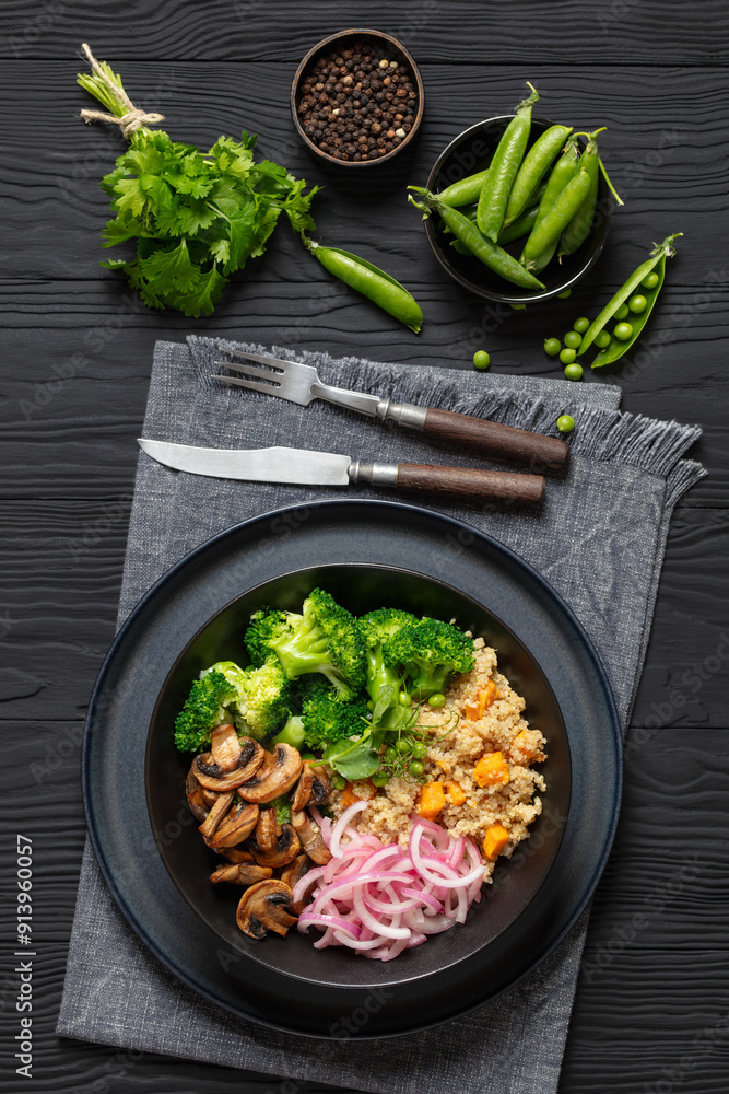 Poster quinoa with veggies and mushrooms in a bowl