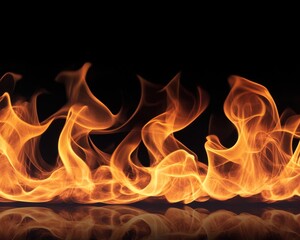 Fototapeta premium Fiery orange and yellow flames dancing against a black background. A dramatic, abstract image of fire.
