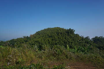 Obraz premium Beautiful Maraingtong Hill, clouds over the mountains, view from the top of mountain, view of a forest, natural beauty Bandarban. Bangladesh