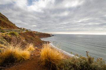 Seascape. Calm sea. Ocean views from the cliff. Sunset at sea. Views of the village of Bajamar and natural pools. Tenerife, Bajamar, Canary Islands.