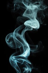 Abstract blue smoke swirling and rising against a black background.